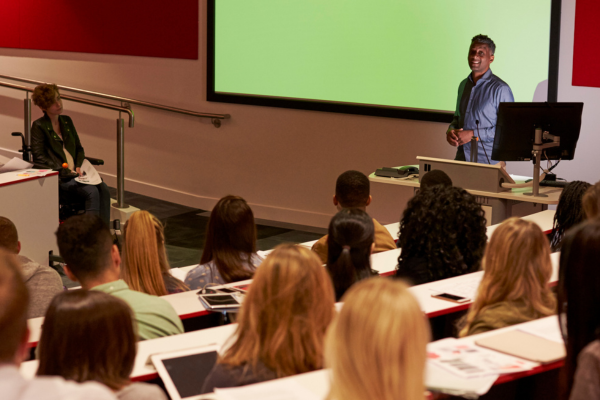 A lecture theatre with students watching a lecturer